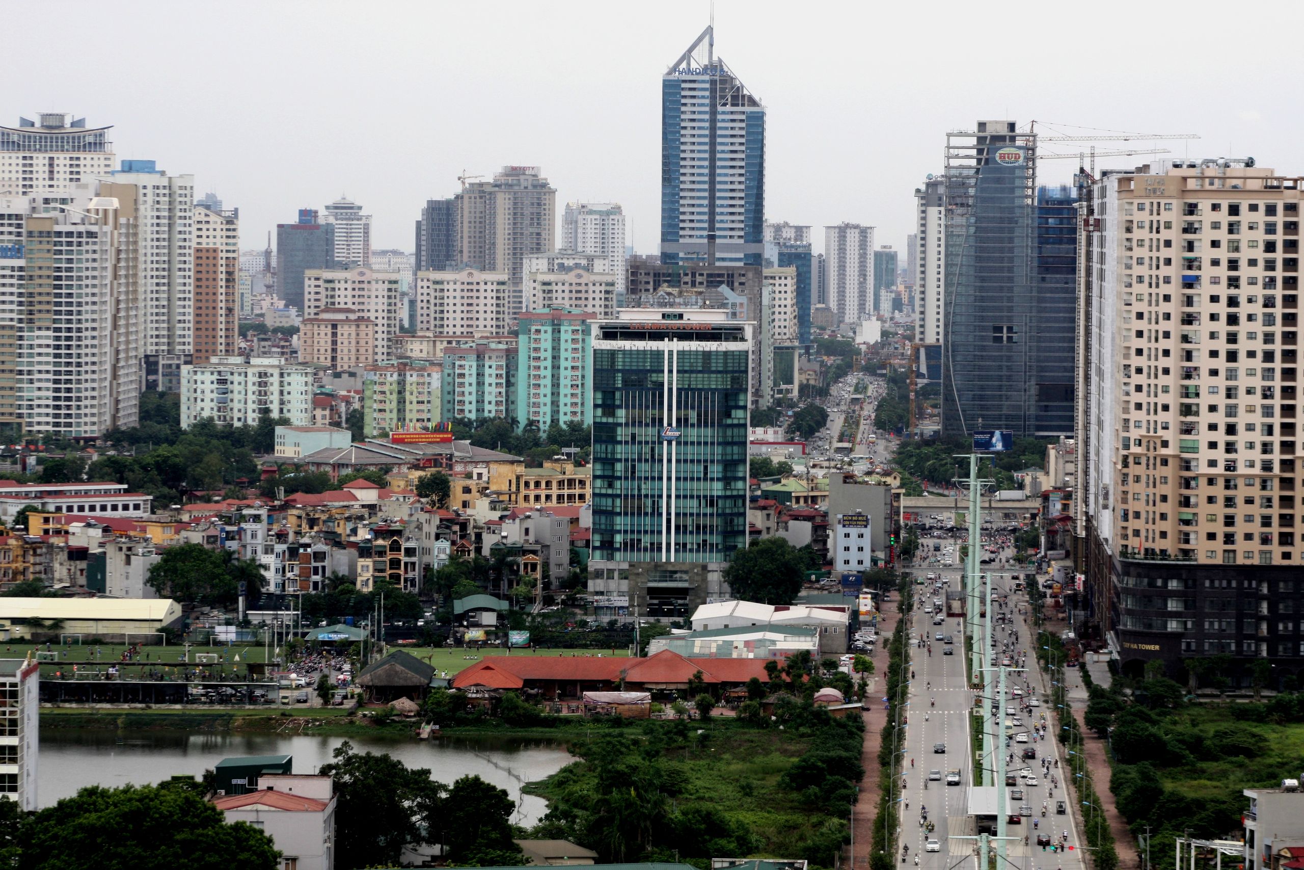 Aerial view of Hanoi showcasing modern skyscrapers and bustling city life.